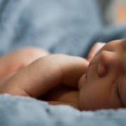 Newborn child on soft blankets