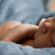 Newborn child on soft blankets